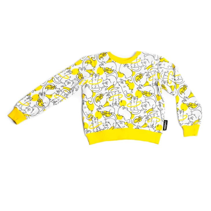 Dziecięca piżamka, góra bluzeczka żółto-czarno-biała w kotki, żółty ściągacz